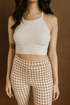 Kenan Crop Top - Beige STYLE + FIT NOTES: ﻿The staple crop that we all need hanging in our closet! // Ribbed material that hugs in all the right places! // We love this styled alone or as the base for a layered look - the options are endless! // Can easily be worn with a strapless bra, but is thick enough to go without all together. // Runs true to size with loads of stretch. Beige Fitted Cropped Halter Top, Fitted Beige Cropped Halter Top, Cream Cropped Top For Day Out, Beige Style, All The Right Places, Strapless Bra, Layered Look, Short Dresses, Crop Top