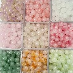 many different colors of beads in plastic containers