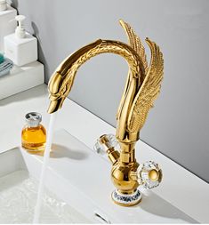 a golden faucet with water running from it