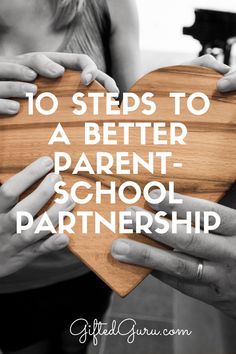 two people holding a wooden heart with the words 10 steps to a better parent - school partner