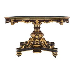 an ornately decorated console table with black and gold paint on the top, against a white background