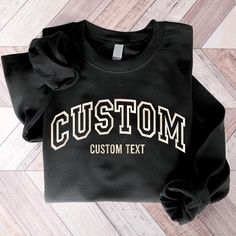 Customization any nicknames, kid names up to 8 kids each sleeve This sweatshirt is perfect to escape the cold. It covers everything from the hips to the neck, allows the person wearing it to stay toasty at all times. Plus, with the side-front pockets, the phone and the wallet can stay warm, too. Suitable for many occasions, such as for Valentine, Christmas, Father's Day, Mother's Day, Birthday,... 8.0 oz., pre-shrunk 50/50 cotton/polyester Blend pill-resistant fleece Two-ply hood with grommets a Crew Neck T-shirt With Letter Embroidery For College, Black Long Sleeve Top With Custom Embroidery, Collegiate Long Sleeve T-shirt With Letter Embroidery, Black Cotton Sweatshirt With Letter Embroidery, Black Cotton T-shirt With Letter Embroidery, Black Crew Neck Sweatshirt With Letter Embroidery, Black College Top With Letter Embroidery, College Crew T-shirt With Embroidered Text, Black Crew Top With Letter Embroidery