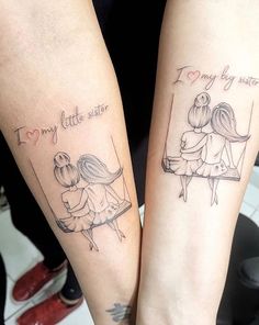 two people with matching tattoos on their arms, one is holding the other's arm