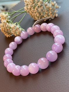 @No returns accepted  Material: Purple Kunzite Cat eye crystal gemstone  Bead size: 10.5MM Wrist: 16.5CM/6.1/2" ** NOTE**--We do our utmost taking photos to be the same as the actual item, however, the color may vary from monitor to monitor. NO enhancement of the color or texture. Kindly feel free to contact us for more photos or with any questions prior to your checkout. We are always very happy to help you. @According to metaphysical beliefs, kunzite is a stone deeply connected to the heart an Adjustable Round Crystal Bracelet With Polished Beads, Adjustable Polished Beads Crystal Bracelet, Adjustable Polished Bead Crystal Bracelet, Cat Eye Crystal, Crystal Bead Jewelry, Bracelet Wrist, Taking Photos, Bead Jewelry, Bead Bracelet