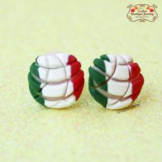 two pairs of earrings with the colors of italy and italy's flag on them