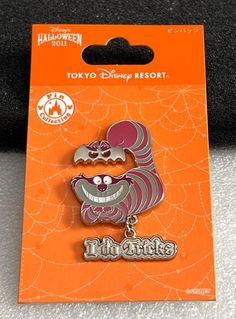 an orange and white pin with a cartoon character on it