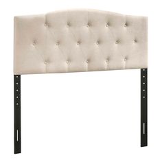 an upholstered headboard with black metal legs and buttoned buttons on it