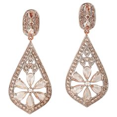 These beautiful drop earrings are handmade in 18-karat gold and set with 2.07 carats of rose cut diamonds. FOLLOW MEGHNA JEWELS storefront to view the latest collection & exclusive pieces. Meghna Jewels is proudly rated as a Top Seller on 1stDibs with 5 star customer reviews. All items manufactured by us are handmade and can be customized or redesigned. Composition Size-37X15 MM Total Weight-9.34 Gold Weight(Gms)-8.926 Diamond Wt(Cts)-2.07 Diamond Flower Earrings, Diamond Flower, Modern Earrings, Top Seller, Rose Cut Diamond, Modern Jewelry, Flower Earrings, Rose Cut, Gold Rose