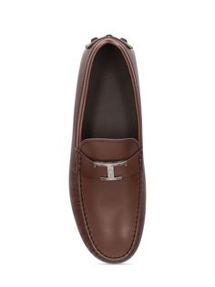 Leather upper. Slip on. Rubber sole Luxury Brown Calf Leather Loafers, Designer Calf Leather Moccasins With Rubber Sole, Brown Luxury Loafers With Leather Footbed, Luxury Brown Loafers With Leather Footbed, Designer Brown Calf Leather Loafers, Luxury Brown Moccasins For Formal Occasions, Designer Calf Leather Loafers With Stitched Sole, Calf Leather Loafers With Leather Sole For Driving, Calf Leather Driving Loafers With Leather Sole