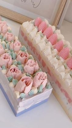 two cakes with pink and white frosting on top of each other next to one another