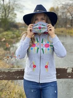 This cute Sweatshirt is perfect for feeling warm and comfortable yet looking stylish with the Floral embroidery on the front. The material is high quality and a combination of cotton and spandex for a comfortable yet slim looking fit. It comes with a matching embroidered face mask! (Included in the price) Casual Multicolor Embroidered Sweater For Spring, Hooded Cotton Tops With Embroidered Graphics, Casual Hooded Sweatshirt With Machine Embroidery, Casual Long Sleeve Hoodie With Machine Embroidery, Casual Long Sleeve Embroidered Hoodie, Hooded Tops With Machine Embroidery For Winter, Casual Hooded Hoodie With Machine Embroidery, Casual Embroidered Multicolor Top, Casual Sweatshirt With Floral Embroidery And Relaxed Fit