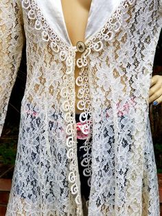 "Long LACE Cardigan in very nice condition. Tag LABEL SAM USA Small medium Measurements Shoulder to shoulder back 16\" Underarm to underarm back 21\" Measurement at button closure 18\" taken flat at front Approximately 34-35\" Shoulder to hem 35\" plus tassel. Thanks for browsing through our shop, have an awesome day" Fitted White Outerwear For Festival, Vintage Fitted Summer Cardigan, Fitted Vintage Summer Cardigan, Fitted Long Sleeve Cardigan For Festival, Fitted Vintage Outerwear For Festival, Fitted Long Cardigan For Festivals, Vintage Fall Festival Cardigan, Fitted Vintage Cardigan For Spring, Long Lace Cardigan