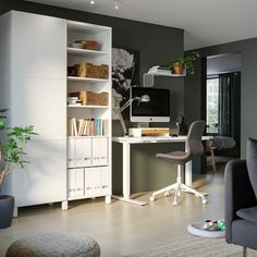 a room with a chair, desk and bookshelf