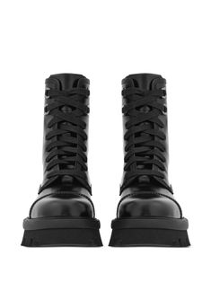 Find SALVATORE FERRAGAMO Chunky-sole Combat Boots on Editorialist. black calf leather round toe front lace-up fastening ankle-length ridged rubber sole Calf Leather Boots With Front Lace-up And Round Toe, Black Leather Boots With Front Lace-up Fastening, Black Lace-up Boots For Streetwear, Lace-up Calf Leather Boots With Vibram Sole, Lace-up Calf Leather Moto Boots With Rubber Sole, Lace-up Calf Leather Boots, Leather Platform Boots With Lace-up Fastening For Streetwear, Leather Platform Boots With Front Lace-up For Streetwear, Black Leather Combat Boots With Lace-up Fastening