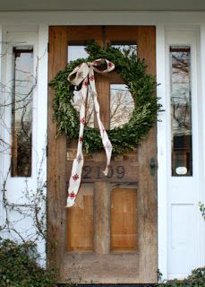 a wreath on the front door of a house