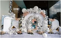 a table topped with balloons and decorations