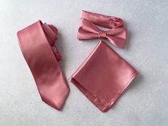 "We proudly present our solid dusty rose satin tie collection. -Hand-sewn semi skinny Adult Neck Tie -Pre-tied Bow tie available from Newborn up-to Adult size with adjustable strap. (Bow tie stitched into place) -Pocket square. Material: Satin, 100% Wool interlining for necktie Measurements: The necktie is appx. 56\" or 142 cm in length or longer if requested. The widest part measures 2 3/4\" or 7 cm Pocket square measure approximately 10\" squares. Our experienced team has over 100 years worth Wedding Satin Ties With Satin Finish, Wedding Ties With Satin Finish, Pink Standard Tie For Groom, Pink Standard Tie Suit Accessories For Groom, Solid Color Wedding Tie With Satin Bow, Solid Wedding Tie With Satin Bow, Tie Collection, Kids Bow Ties, Groom Groomsmen