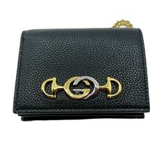 Made of leather: Detachable chain in gold tone; 5 card slots, 1 money compartment, 1 slip pocket, 1 coin pocket; Measurements: Size: 4.25" x 3.5", removable chain drop: 4" Inches; Comes with box; Made in Italy. Gucci Dionysus Wallet On Chain Velvet, Luxury Black Wallet On Chain With Gold-tone Hardware, Black Gold Chain, Mini Wallet, Leather Chain, Sale Event, Luxury Branding, Gold Chains, Leather Women