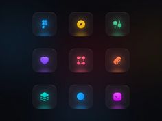 a set of different colored icons on a black background with some blurry lights around them