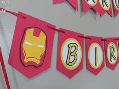 this is an image of a birthday banner with iron man decorations on the front and back