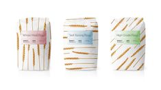 three different types of bread bags with wheat stalks on the front and side, each wrapped in white paper