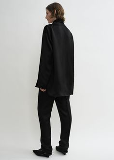 Hip-length TOTEME blouse defined with an ample funnel neck that drapes effortlessly over the chest. It is made from double-faced satin with an oversized silhouette that feels fluid and structured in equal measure. Wear it as part of a monochromatic evening look. Oversized Black Tops With Funnel Neck, Sleek Black Funnel Neck Tops, Oversized Cotton Funnel Neck Top, Oversized Solid Funnel Neck Top, Luxury Black Funnel Neck Top, Denim Outerwear, Swim Shop, Satin Blouse, Scarf Hat