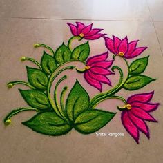 a flower design on the ground with green leaves and pink flowers painted on it's side