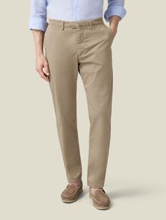 Elevate your spring-summer wardrobe with our whipcord cotton chinos, crafted in Northern Italy from lightweight and durable whipcord cotton. This breathable fabric is blended with 3% elastane for added stretch ensuring a more comfortable and easier fit.    Our chinos feature a mid-rise and slightly tapered fit, designed to provide a refined and sophisticated look. With a focus on practicality, this piece is tailored with four convenient pockets and bespoke details such as a concealed triple butt Slim Fit Chinos In Chino Cotton Twill For Spring, Spring Business Casual Chinos In Cotton Twill, Slim Fit Cotton Chinos For Business Casual, Stretch Cotton Chinos For Business Casual, Beige Tapered Leg Cotton Chinos, Beige Cotton Chinos With Welt Pockets, Fitted Beige Cotton Chinos, Cotton Chinos, Northern Italy