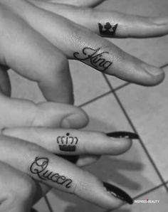 three fingers with crown tattoos on them and the word queen written in cursive writing