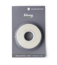 a roll of white fabric tape on top of a packaging package for the fabuny sewing machine