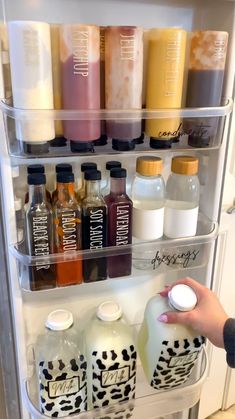 a refrigerator door is filled with bottles and containers