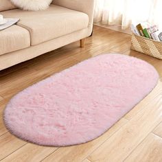 a pink rug on the floor in a living room