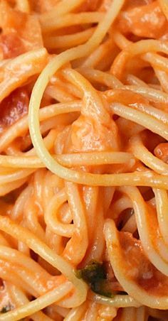 a close up view of some noodles with sauce