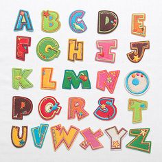 the letters and numbers are made out of patchwork material, which is very colorful