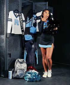 a woman in a cheerleader uniform standing next to lockers with cheerleader gear