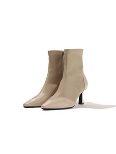 Editor's NotesLOVEDEWY's shoes will add elegance to your daily outlook- Span ankle boots- Modern chic pointed toe line- two tone leather texture- Set on a stacked heel for the comfortable fitMeasurements(in.)- KR 225mm (US 5.5) - KR 250mm (US 8)- Fits true to the size Composition & Care- Leather- Professional leather careDesigner- by LOVEDEWY Elegant High Ankle Cream Boots, Beige High Heel Boots For Work, Beige High Heeled Boots For Workwear, Beige High Heeled Boots For Work, Chic High Ankle Heeled Boots With Contrasting Heel Counter, Beige Ankle Boot Heels For Work, Beige Heeled Boots For Workwear, Cream Boots For Office In Fall, Office Boots With Pointed Toe And Contrasting Heel