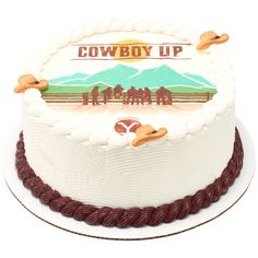 a cowboy up cake on a white plate