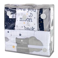 three piece bedding set with stars and moon print on the front, two sheets in white