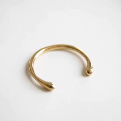 Bawa Hope's Artisan Made Brass Cuff is the perfect statement piece. This cuff can be styled with any outfit of your choosing for ease to wear. Minimalist Yellow Gold Brass Cuff Bracelet, Adjustable Yellow Gold Brass Cuff Bracelet, Handmade Minimalist Brass Bangle, Artisan Gold Cuff Bracelet Hand Wrapped, Minimalist Handmade Brass Bangle, Adjustable Open Ring Yellow Gold Bracelet, Minimalist Adjustable Brass Cuff Bracelet, Circle Bracelet, Brass Cuff