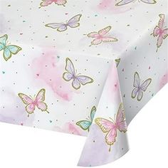 a table cloth with pink and blue butterflies on it