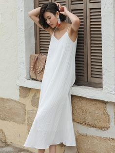 Long, A-line dress. V-neck and narrow, adjustable shoulder straps. Lined.- Maxi- A-line- V-neck Chic V-neck Sundress With Adjustable Straps, V-neck Dress With Tie Straps For Day Out, Elegant A-line V-neck Dress For Beach, Elegant A-line V-neck Beach Dress, Chic V-neck Slip Dress With Tie Straps, Chic V-neck Suspender Dress For Brunch, Casual V-neck Dress With Adjustable Straps, Chic V-neck Spaghetti Strap Beach Dress, Summer A-line Suspender Dress For Brunch