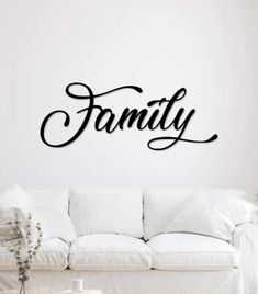 a wall decal with the word family in cursive font on it's side