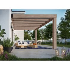 an outdoor living area with couches, tables and chairs under a pergolated roof