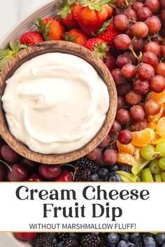 cream cheese fruit dip in a bowl surrounded by grapes and strawberries