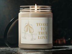 a candle with toast to true love on it