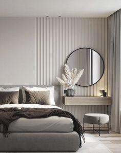 a bedroom with a bed, mirror and chair