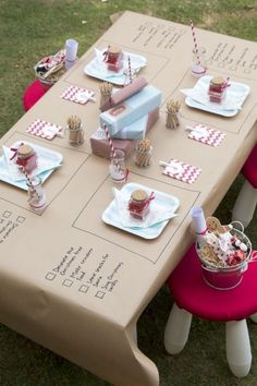 a picnic table set up with red and white napkins