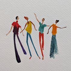 three women are dancing with their arms in the air and one is wearing colorful pants