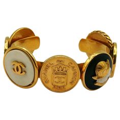 CHANEL vintage iconic gold tone bangle bracelet featuring coins : Crowned CC CHANEL 31 Rue Cambon Paris, Elephant, Helmeted Guards, CC logos and a Lady profile. Embossed CHANEL. Indicative measurements : inner measurements approx. 5.9 cm x 4.6 cm (2.32 inches x 1.81 inches) / max. width approx. 2.4 cm (0.94 inch) / wrist opening approx. 2.6 cm (1.02 inches). Material : Gold tone metal hardware / Resin. Comes with the original CHANEL box (very used vintage condition). NOTES - This is a preloved v 31 Rue Cambon, Vintage Chanel Jewelry, Chanel Box, Chanel Vintage, Chanel Jewelry, Virtual Fashion, A Lady, Vintage Chanel, Arm Candy