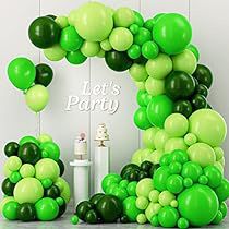 green and white balloons are arranged in the shape of an o for a birthday party